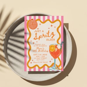 May include: A birthday party invitation with a pink and white striped design. The invitation features the words "Just a Spritz Older" in orange script, and a cocktail illustration. The invitation is for Olivia's 30th birthday.