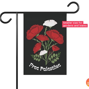 May include: A black garden flag with a white background featuring red poppies and white flowers. The text "Free Palestine" is printed in white on the flag.