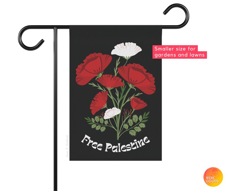 May include: A black garden flag with a white background featuring red poppies and white flowers. The text "Free Palestine" is printed in white on the flag.