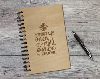 May include: A wooden spiral bound journal with a compass design and the quote "You only live once, but you do it right, once is enough".