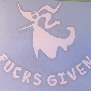 May include: A white vinyl decal of a cartoon ghost with the text "F**KS GIVEN" below it.