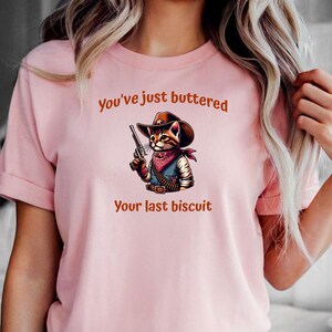 Funny Cowboy Cat Tee, Meowdy Partner Unisex T-Shirt, Cozy Cat Shirt - Buttered Biscuit Design, Cat Lover Gift, Country Western Top, Humorous