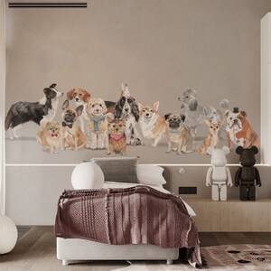 May include: A white bed with a brown blanket and a wall mural featuring a group of dogs wearing party hats. Two toy robots stand on a shelf below the mural.
