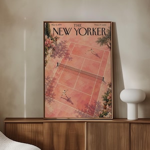 May include: A framed magazine cover titled The New Yorker, dated May 12, 1979, featuring an aerial illustration of two people playing tennis on a red clay court surrounded by trees and flowering bushes, with the price listed as 25 cents.
