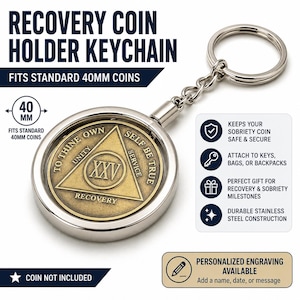 May include: A silver-toned metal recovery coin holder keychain designed to fit standard 40mm coins. The circular holder features a bronze-colored coin with a triangle, the Roman numeral XXV, and the text To Thine Own Self Be True.