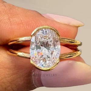2.00 CT Oval Lab Grown Diamond Engagement Ring: Half Bezel Split Shank, IGI Certified