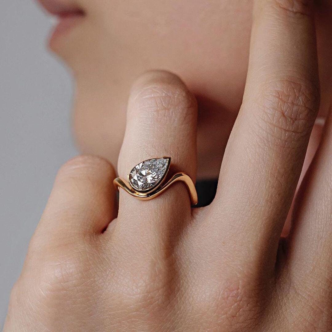 2.00 CT East-West Pear Cut Lab Grown Diamond Solitaire Engagement Ring , Low Set In Semi Bezel Set 18K Yellow Gold Lab Diamond Ring .