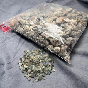 May include: A set of three ceramic mugs with a speckled, matte finish. The mugs are in shades of cream, light gray, and dark gray. Each mug has a simple, minimalist design, perfect for coffee or tea.