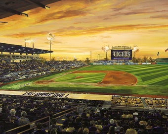 May include: A baseball stadium with a large crowd of people in the stands. The scoreboard reads "TIGERS" and the field is green with a brown infield. The sky is a vibrant orange and yellow sunset.