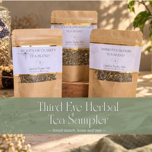 May include: Three brown kraft paper pouches containing loose leaf tea blends. The labels read Roots of Clarity Tea Blend, Intuition & Dreamweave Tea Blend, and Third Eye Bloom Tea Blend. Each pouch features a clear window showing the dried herbs.