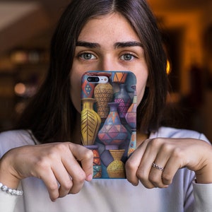 May include: A colorful phone case with a geometric pattern of vases and other pottery. The case is blue, yellow, green, pink, and orange.