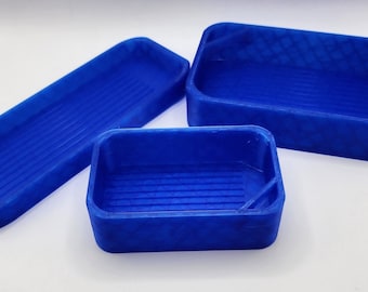 May include: Three blue plastic containers of different sizes. The containers have a textured surface and are ideal for storing small items.