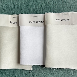 Muestras de color de tela: blanco puro, marfil, blanquecino