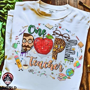 May include: White t-shirt with a colorful graphic design. The design features the words "One Dope Teacher" with various school-themed illustrations, including an apple, glasses, and pencils. The shirt is made of a soft, comfortable material.