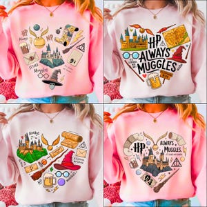 Puede incluir: Sudaderas rosas con un diseño en forma de corazón con elementos de una serie de fantasía. Los diseños incluyen un castillo, una snitch dorada, un sombrero de bruja y el texto "Always + Muggles."