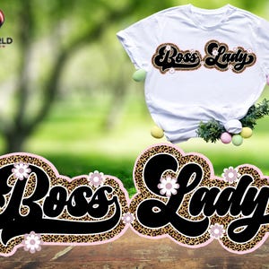 May include: A white t-shirt with the words "Boss Lady" in black script with a leopard print and pink flowers. The words are also shown separately on a black background with a leopard print and pink flowers.