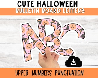 May include: Cutout letters spelling "ABC" with a Halloween pumpkin and witch hat pattern. The letters are pink and white with orange pumpkins and black witch hats. The image also includes the text "CUTE HALLOWEEN BULLETIN BOARD LETTERS" and "UPPER NUMBERS PUNCTUATION".
