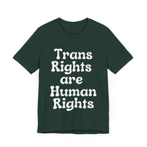 May include: A dark green t-shirt with the text "Trans Rights are Human Rights" in white.