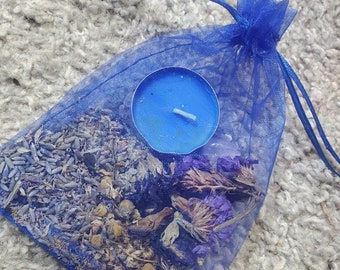 May include: A blue mesh bag filled with dried lavender and other herbs, with a blue tealight candle inside.