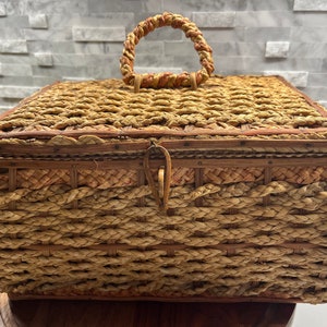 Antique wicker sewing basket with  red silk lining