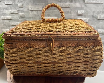 Antique wicker sewing basket with  red silk lining