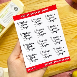 May include: A sheet of stickers with the text "Replace Face Razor" repeated 10 times. The stickers are white with black text and are arranged in a grid pattern. The sheet is labeled "CERISE STICKER SHOP" and "SKIN-8" in the top right and bottom left corners, respectively.