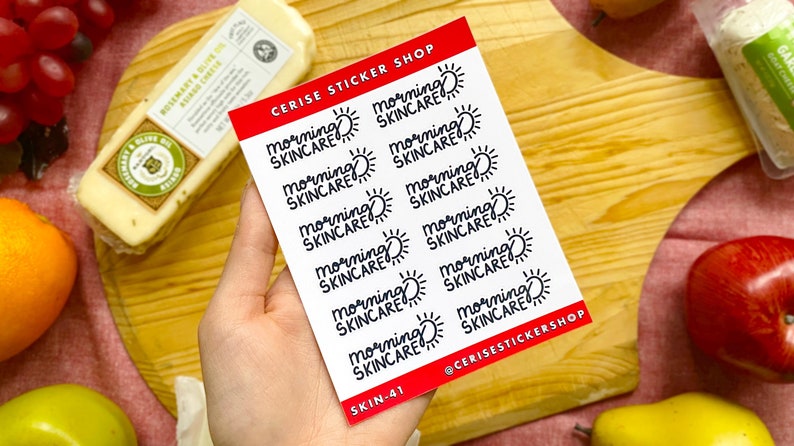 May include: A sheet of stickers with the text "morning skincare" and a sun graphic. The stickers are on a red background with white text. The sheet is labeled "Cerise Sticker Shop" and "Skin-41".