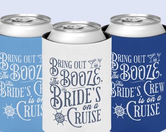 May include: Three drinks can coolers in blue, white, and navy blue. Each cooler has the text "Bring Out The Booze, This Bride's Crew is on a Cruise" in a decorative font, with a cocktail glass and a ship's wheel graphic.