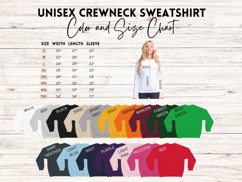 May include: Unisex crewneck sweatshirt size chart with measurements in inches. The chart shows the width, length, and sleeve length for sizes S through 5XL. The chart is displayed on a woodgrain background. The sweatshirt is available in a variety of colors, including white, ash, black, sand, sport grey, gold, orange, maroon, forest green, Irish green, dark heather, light blue, navy, purple, light pink, heliconia, and red.