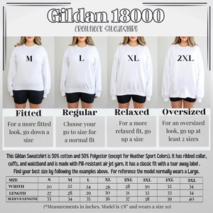 May include: A size chart for Gildan 18000 crewneck sweatshirts. The chart shows the different sizes available, from S to 5XL, and the corresponding measurements in inches for width, length, and sleeve length. The chart also includes a description of the fit for each size: fitted, regular, relaxed, and oversized.