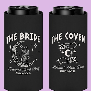 May include: Black can coolers with white text and illustrations. One cooler says "THE BRIDE" with a crescent moon and hand design. The other says "THE COVEN" with hands and a crescent moon. Both say "Lauren's Bach Party, Chicago IL."