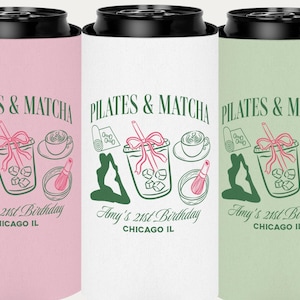 May include: A white ceramic mug with a black handle and the text "But First, Coffee" in a bold, black font. The mug is set against a blurred background, suggesting a cozy setting.