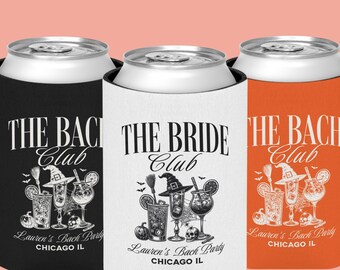 May include: Three beverage can coolers in black, white, and orange. Each cooler features a Halloween-themed design with the text "THE BACH Club" or "THE BRIDE Club" and "Lauren's Bach Party CHICAGO IL".