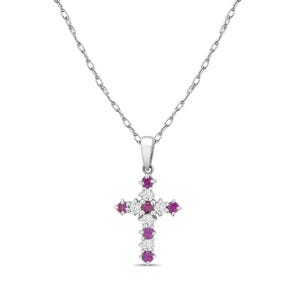May include: A silver-toned necklace featuring a cross pendant. The cross is adorned with alternating round, red gemstones and small, round, clear gemstones. The necklace chain is delicate and hangs from the pendant.