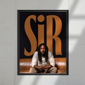 May include: A black and white poster with the word "SIR" in large, orange letters. A man with long dreadlocks is sitting on a brown leather couch, wearing a white long-sleeved shirt.