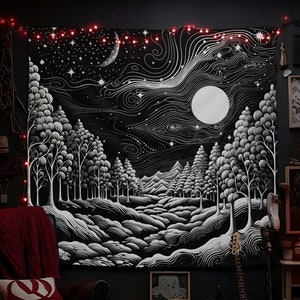 May include: Black and white tapestry with a moon and stars, depicting a forest scene with trees and a winding path. The tapestry is hanging on a wall with string lights and other wall decor.