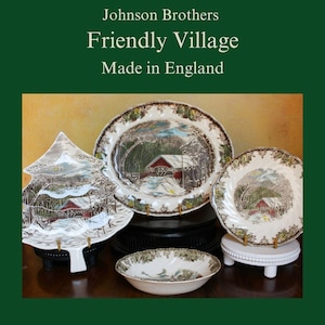 May include: A set of four Johnson Brothers Friendly Village dinnerware pieces, including a platter, a bowl, a small plate, and a tree-shaped serving dish. The pieces feature a winter scene with a red-roofed house and a bridge over a stream.
