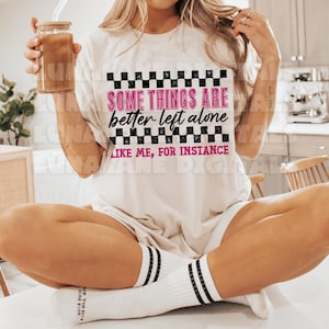 May include: A white ceramic mug with a black handle and the text "But First, Coffee" in a black, bold font. The mug is sitting on a white surface. The mug appears to be 12 ounces.