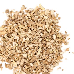 May include: A collection of small, irregularly shaped pieces of dried plant root. The fragments vary in size and texture, displaying a range of light tan, beige, and off-white colors with a fibrous, woody appearance throughout the pile.