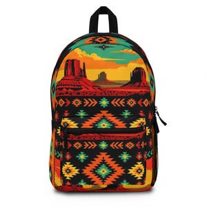 May include: A black backpack with a Southwestern desert landscape design. The backpack features a front pocket, side mesh pocket, and a top handle. The design includes red rock formations, a sunset sky, and geometric patterns in orange, yellow, and green.