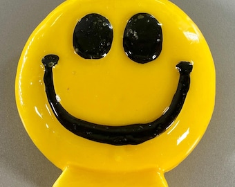 Unusual bright vintage smiley face candle .
