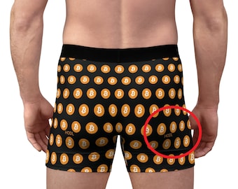May include: Black boxer shorts with a repeating pattern of orange Bitcoin symbols. The words "HODL" are printed on the shorts.