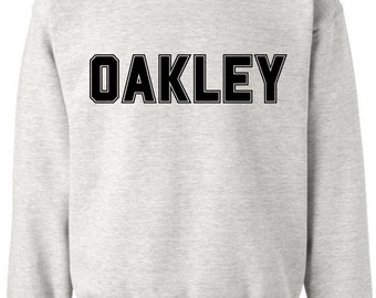 トップス 1990s oakley l logo nylon pullover Vintage 1990s Oakley Graphic Hoodie / 90s Hoodie / Vintage Sweater