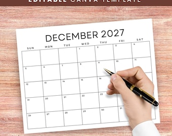 May include: A white paper calendar for December 2027 with black grid lines and text. The calendar features a header reading "EDITABLE CANVA TEMPLATE" and the month "DECEMBER 2027". A black pen is positioned over the grid of the calendar page.