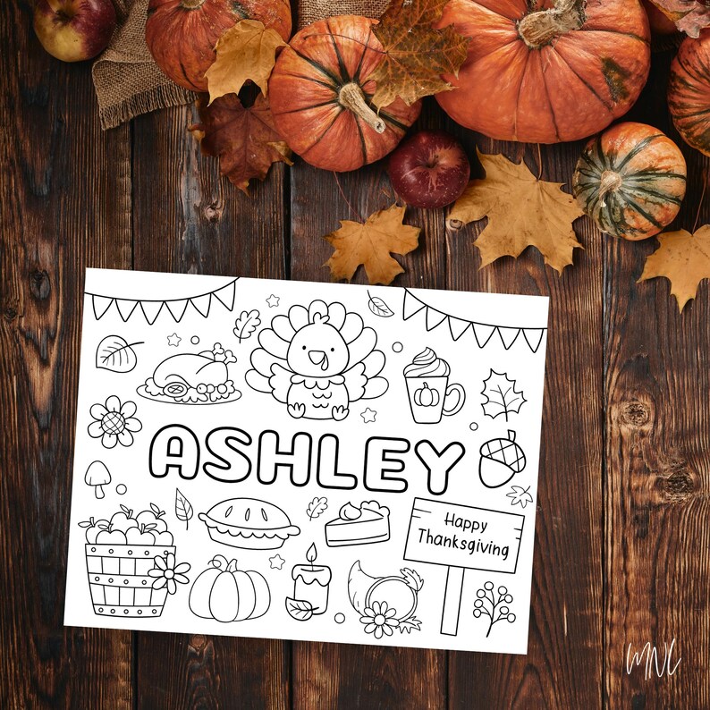 May include: Black and white Thanksgiving-themed coloring page with the name "Ashley" in large letters. The page features a turkey, pumpkin spice latte, pie, and other festive illustrations. A sign reads "Happy Thanksgiving."