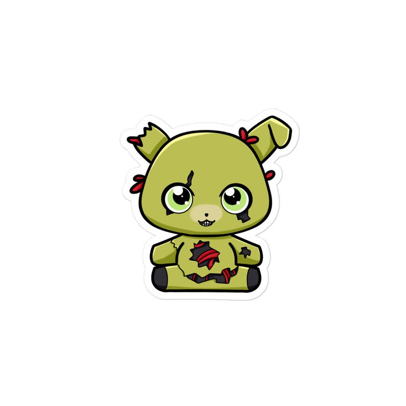 May include: A cartoon plush toy of a green, yellow, and red animatronic bear with a ripped and torn body. The bear has large, black eyes and a wide, toothy grin.