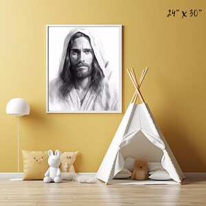 May include: A black and white drawing of Jesus Christ in a white robe with a hood. The drawing is framed in a white frame and is hanging on a yellow wall. The image is 24 inches by 30 inches.