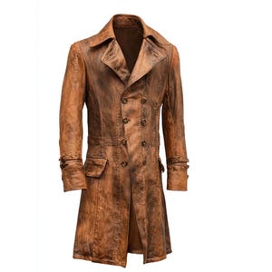 May include: A brown leather coat with a double-breasted design. The coat features a notched collar, two front pockets, and buttoned cuffs. The coat's length extends to the mid-calf. The leather has a distressed, weathered appearance.