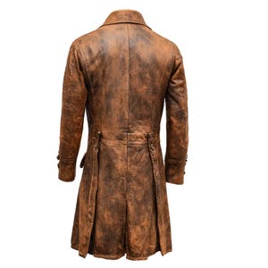 May include: A brown, long leather coat with a distressed finish. The coat features a notched lapel, buttoned cuffs, and a pleated back. The coat's length extends to the mid-calf.