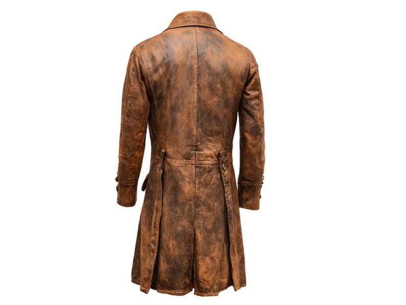 May include: A brown, long leather coat with a distressed finish. The coat features a notched lapel, buttoned cuffs, and a pleated back. The coat's length extends to the mid-calf.